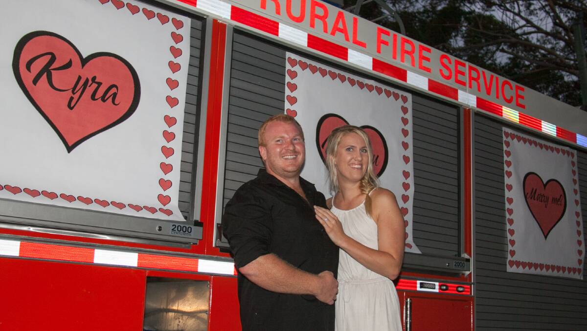 SHE SAID YES: Harrison Wright with his fiance Kyra McGrorey-Clark. Mr Wright took three weeks to plan the proposal and pulled it off with the help of the Medowie Rural Fire Brigade, where he is deputy captain. Picture: Supplied.