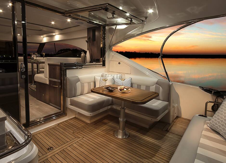 CHEERS: Sit back in comfort and style and soak up the pristine waters of Port Stephens from the spacious cockpit.