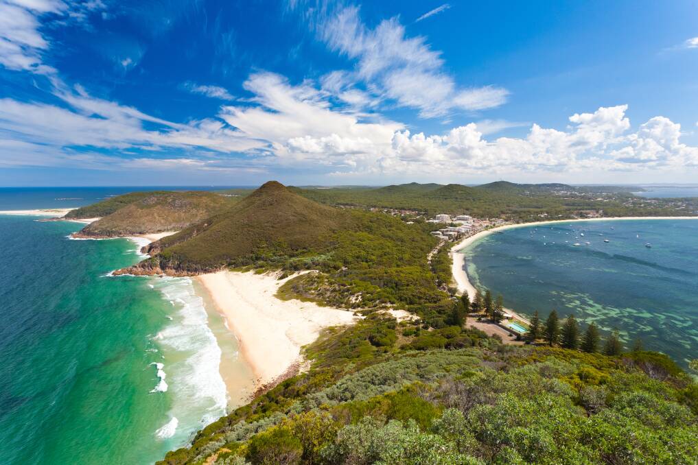 Stunning: The beautiful view from Mount Tomaree look out in Port Stephens shows just one of the reasons this scenic spot is becoming the place of choice for home buyers and investors.