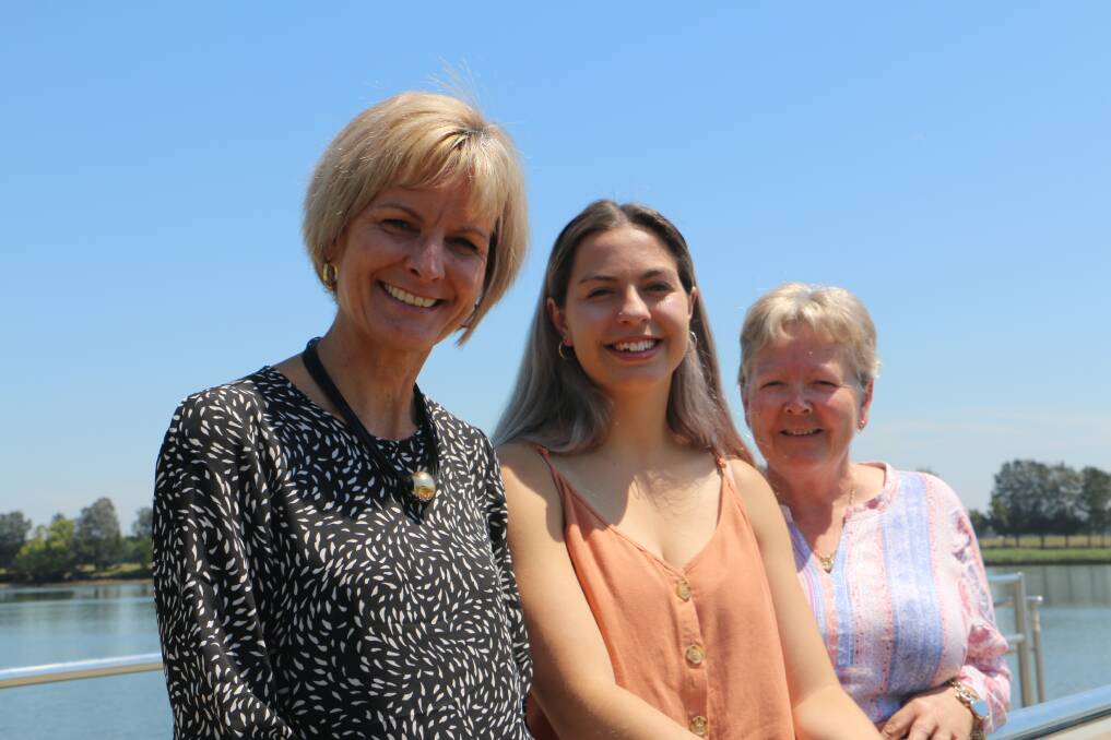 MarketPlace Raymond Terrace centre and marketing manager Colleen Mulholland-Ruiz with Nakkitah Leard, 16, the Examiner's 2019 Annual Business Awards voter prize winner, and her grandmother, Karen Leard.