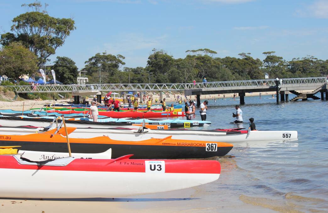 BIG EVENT: Outrigger canoes on Shoal Bay Beach during the April 2-3 state titles hosted by the Port Stephens club.