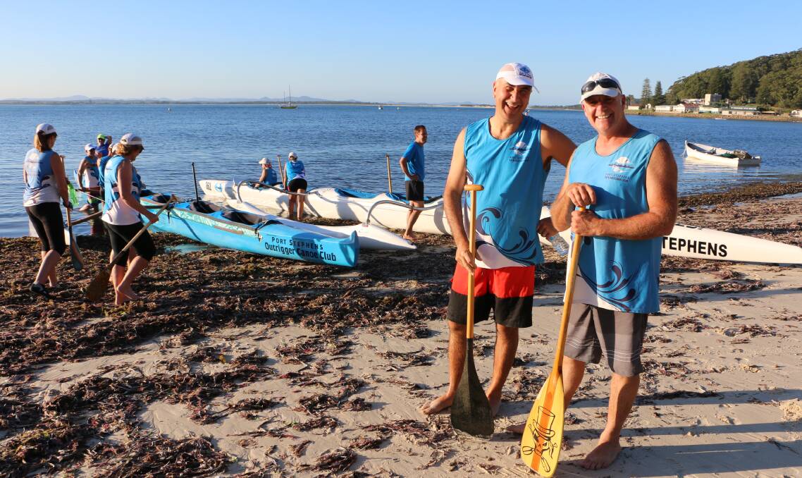 CHUFFED: Port Stephens Outrigger Canoe Club president Jim Papadopoulos and vice president Dean McGuinness at Shoal Bay for training ahead of the state titles. Picture: Ellie-Marie Watts