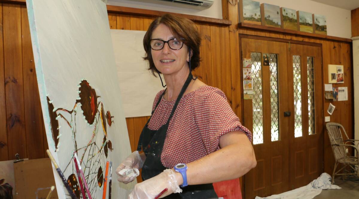 PAINTER: One Mile artist Linda Greedy pictured in her home studio. Ms Greedy's painting Freak Out is currently on exhibit in South Australia. Picture: Stephen Wark