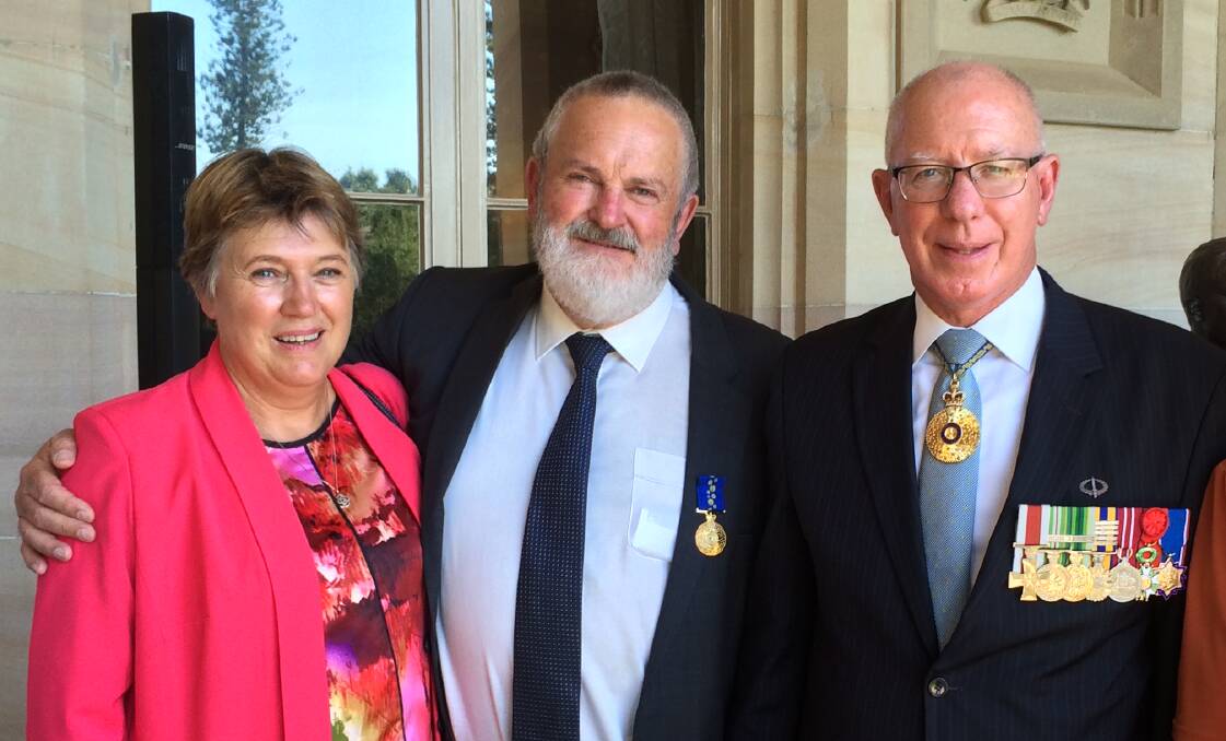 OAM: Judy McGowan with husband Rodney Starr and NSW Governor David Hurley at Government House on April 6.