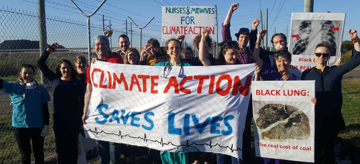 Action: Doctors, nurses, a vet, allied health and public health professionals rally outside Kooragang coal terminal to protest at the lack of government action on climate change.