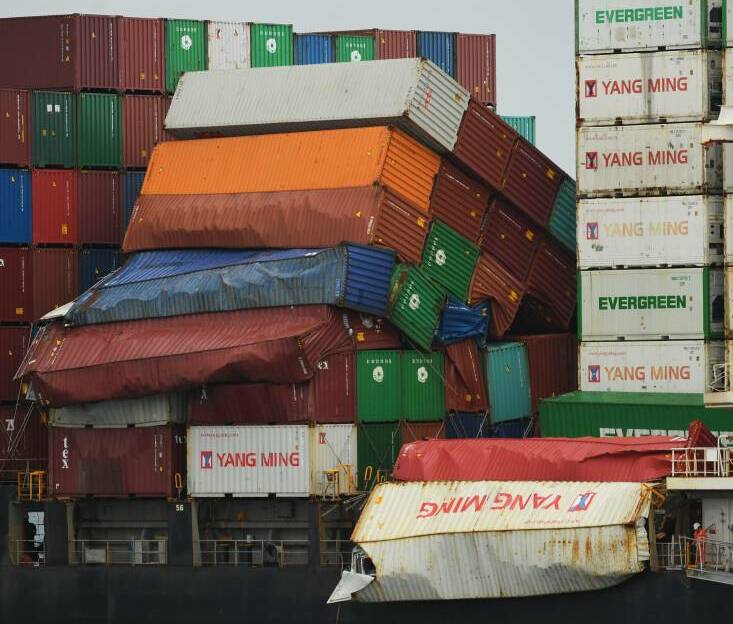 Damaged: Containers on the deck of the YM Efficiency after it was hit by heavy "rolling" for up to 90 seconds off the Newcastle coastline on June 1.