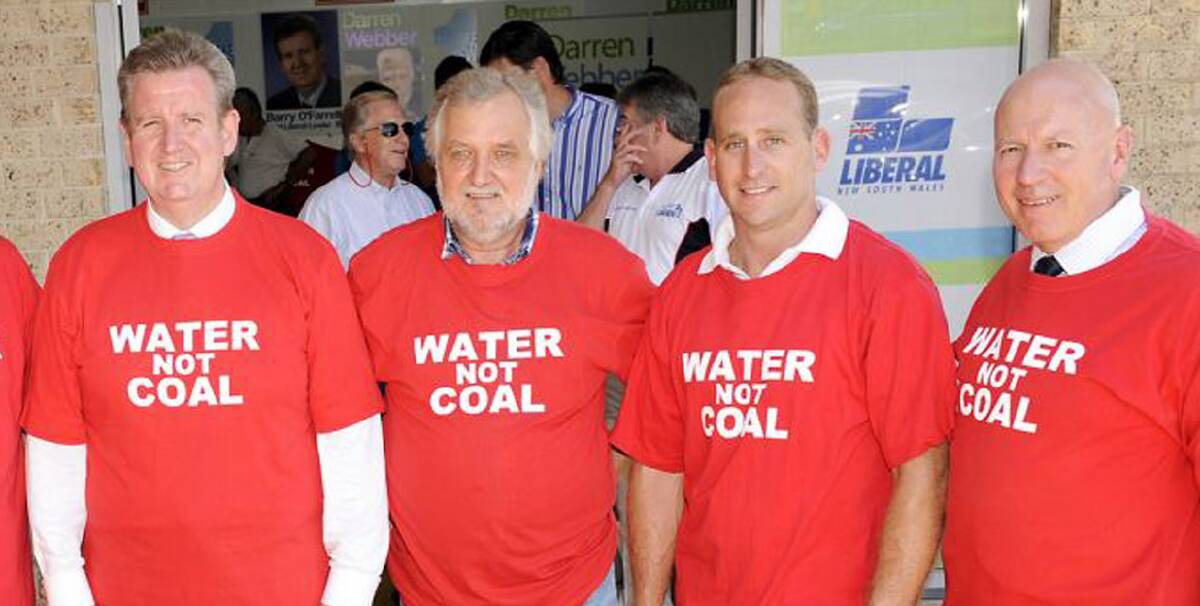 Memories: Opposition Leader Barry O'Farrell, Australian Coal Alliance founder Alan Hayes, Liberal candidate Chris Spence and the then senior NSW Liberal Chris Hartcher during the 2011 NSW election campaign where Mr O'Farrell made a "no ifs, no buts" promise to stop the controversial Wallarah 2 coal mine.