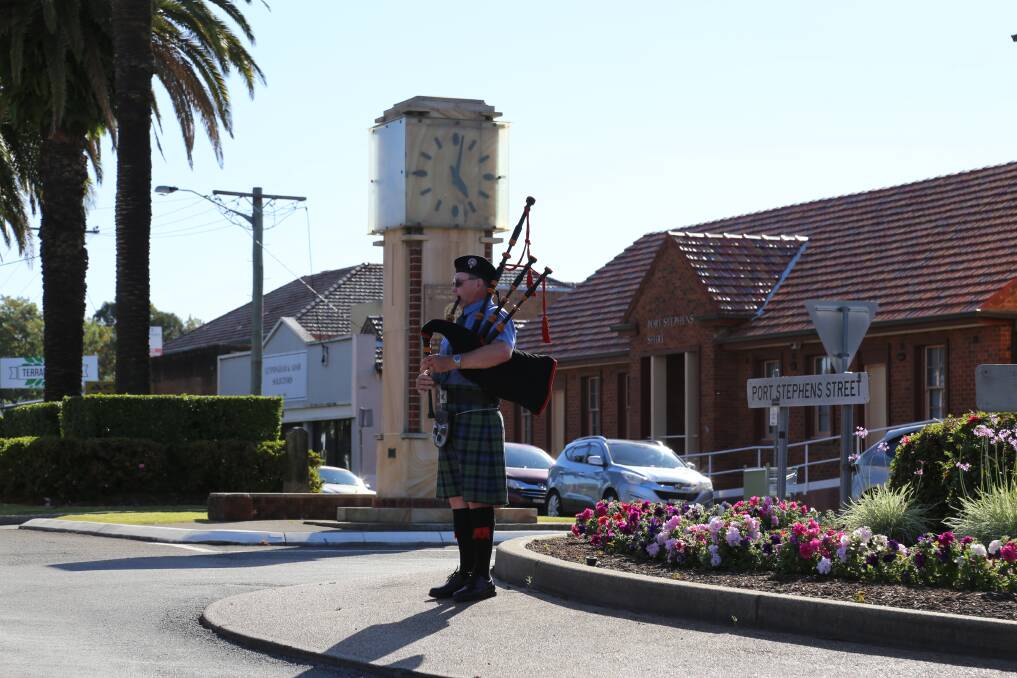 Heatherbrae piper Ron Baillie performed The Battle's O'er in Raymond Terrace as a special tribute to mark the centenary of Armistice on November 11, 2018. Picture: Ellie-Marie Watts