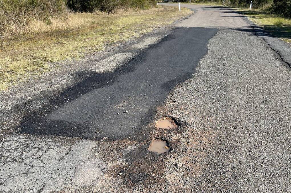 EDUCATION: A road on the Tilligerry Peninsula with fresh potholes around a previous hot mix fix. Picture: Cr Leah Anderson