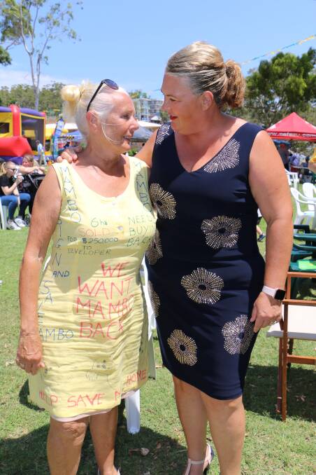 A Mambo-Wanda Wetlands Conservation Group president Irene Jones wearing a dress with "we want Mambo back" and other similar slogans written on it. She was collecting signatures for the petition at the Nelson Bay Australia Day event. Ms Jones is pictured with Paterson MP Meryl Swanson. Picture: Ellie-Marie Watts