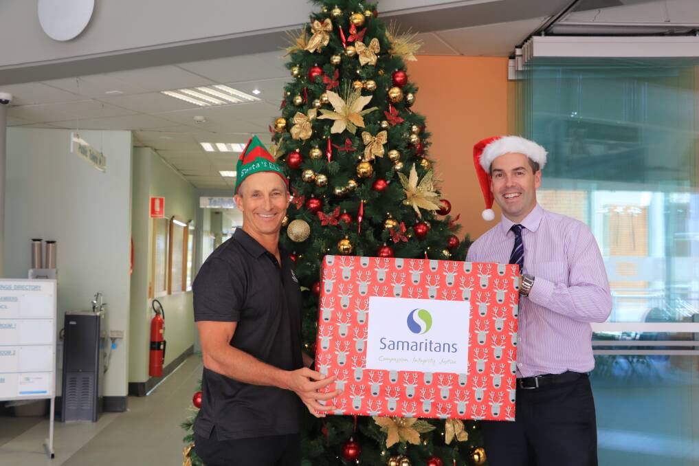 Port Stephens Council general manager Wayne Wallis and Mayor Ryan Palmer in front of the Samaritans Giving Tree at the Raymond Terrace council administration building.