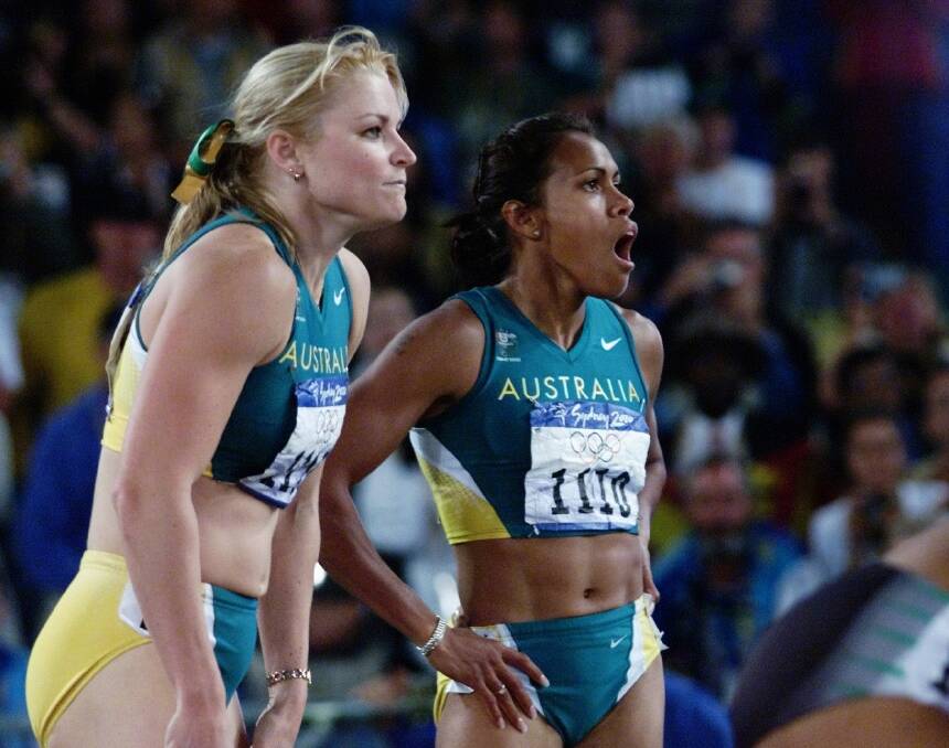 Melinda Gainsford-Taylor and Cathy Freeman after the 200m final at the 2000 Sydney Olympic Games. Picture: Craig Golding