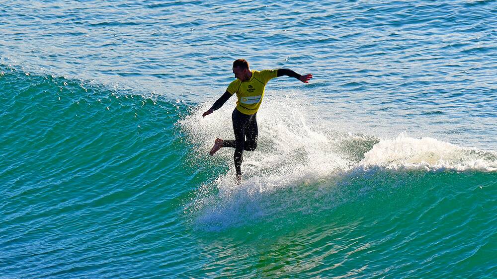 Jayce Pioli (Milton) put on a thrilling display of traditional longboarding to take out the men’s logger title on the final day of the Port Stephens Surf Festival on Sunday. Picture: Terry Day / Surfing NSW 