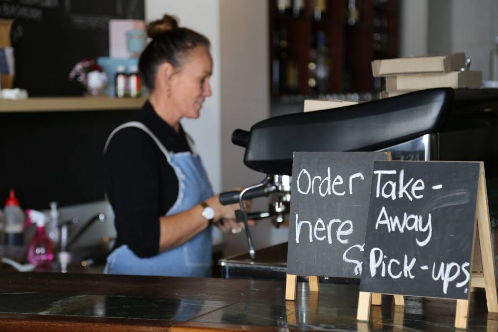 Melissa Stewart making coffee at Evviva Cafe and Bar, Nelson Bay. The shop has reverted back to takeaway only.