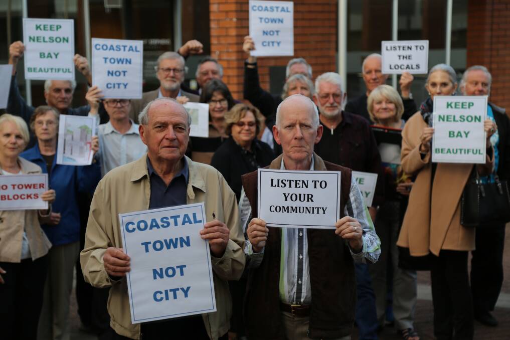 ANGER: Geoff Washington and Nigel Waters from the TRAA with about 25 other residents outside the council chambers on Tuesday afternoon. Picture: Ellie-Marie Watts