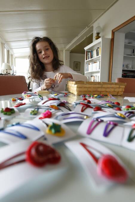 Ana Neale working hard to make jewellery to sell at the Olive Tree Market in Newcastle in 2011. 