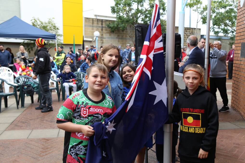 Children helped to raise the Australian flag on Monday morning. Picture: Ellie-Marie Watts