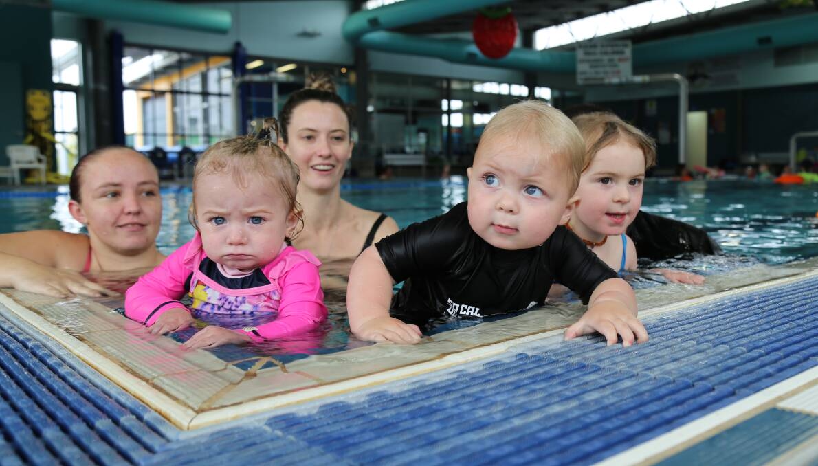 Evelyn Dunn, 1, Lennon Fishburn, 2, Reid Townsend, 2, learning to swim with their parents at Lakeside Leisure Centre. Picture: Ellie-Marie Watts