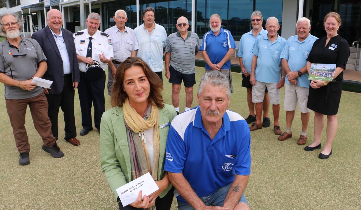 PRESENTATION: Yacaaba Centre manager Petra Offen and Terry O'Brien with representatives from the Nelson Bay Blue Marlins Winter Swim Club and cheque recipients at Nelson Bay Bowling Club, a longtime supporter. Picture: Charlie Elias