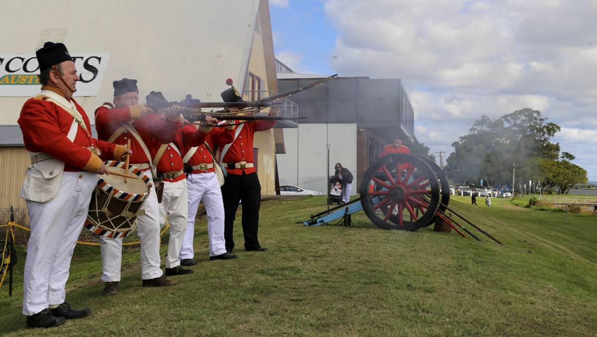The 40th Regiment of Foot in action on the Raymond Terrace riverfront on Saturday for the Step Back Into King Street Heritage Festival. 