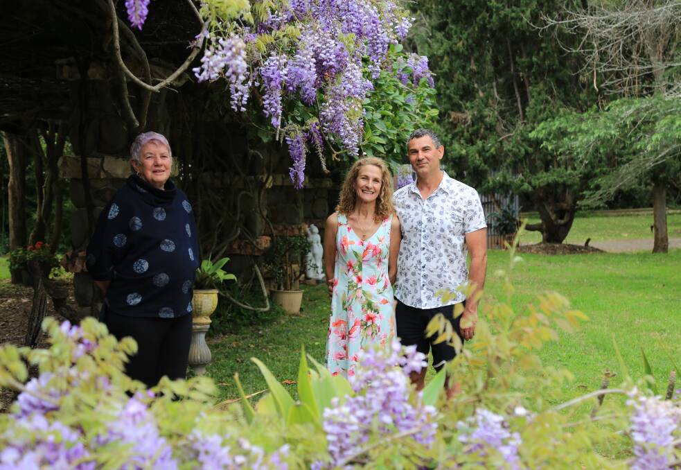 WALK: Fran Corner from Tilligerry Community Association with Tanilba House owners Deidre Hall and Glenn Short in the house's garden. Picture: Ellie-Marie Watts
