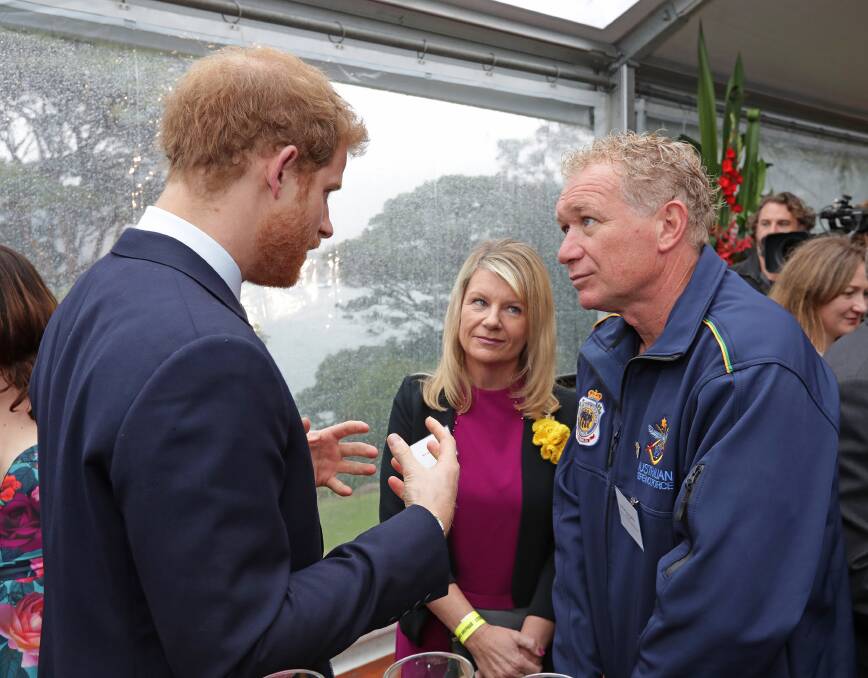 NICE GUY: Prince Harry with Squadron Leader Danny Jeffery, an aeronautical engineer at RAAF Base Williamtown, at the Invictus Games launch in Sydney on June 7.