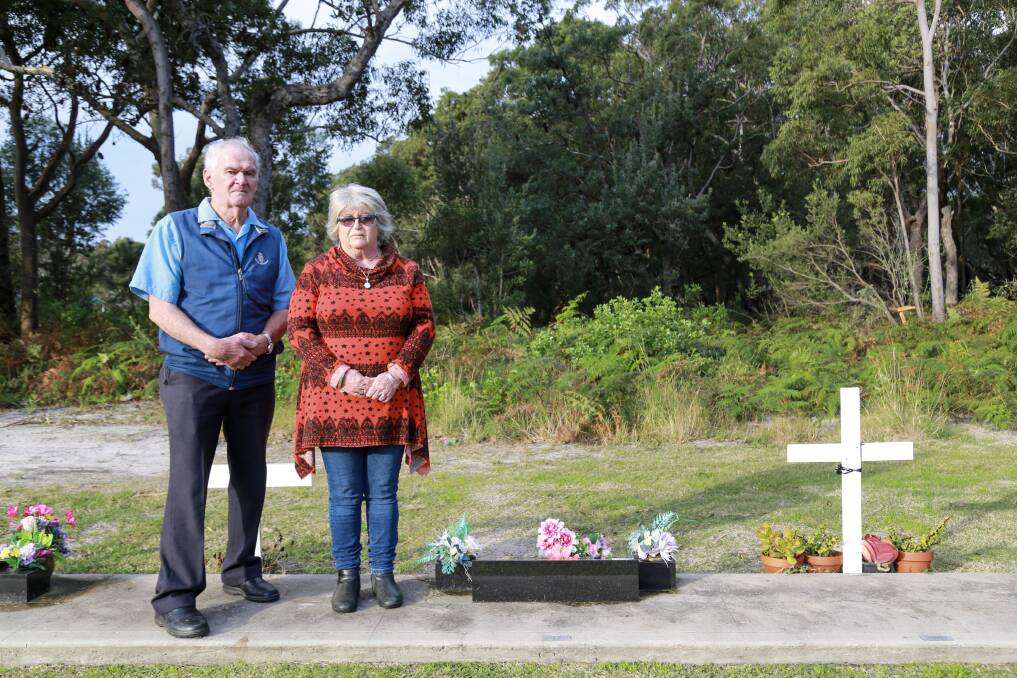 ANGRY: Max Stocker and Glennis Dart standing at the grave of Warwick Dart which is located meters from where the aircraft facility is proposed to be established. Picture: Ellie-Marie Watts