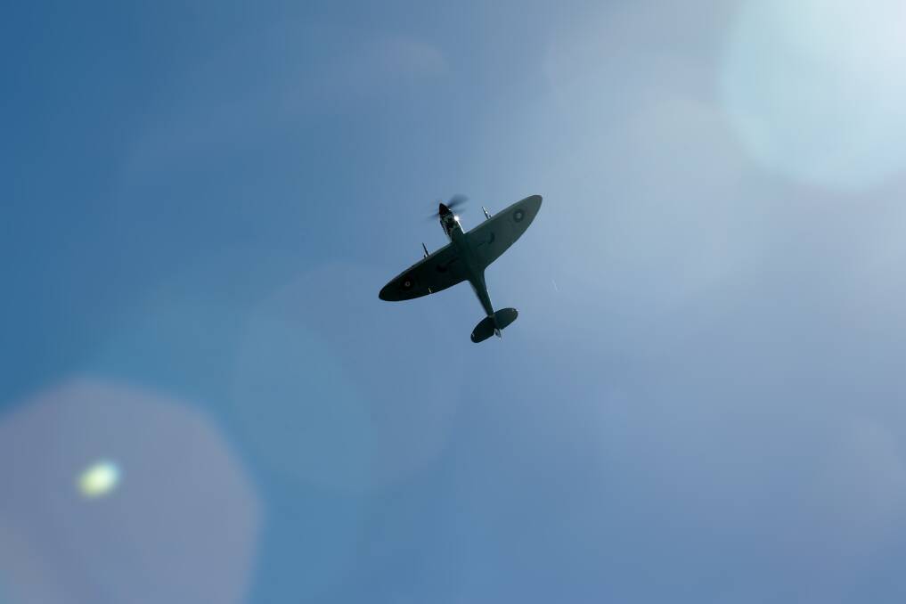 The Spitfire flying over Fighter World at Williamtown on Wednesday, April 21. Picture: Jonathan Carroll 