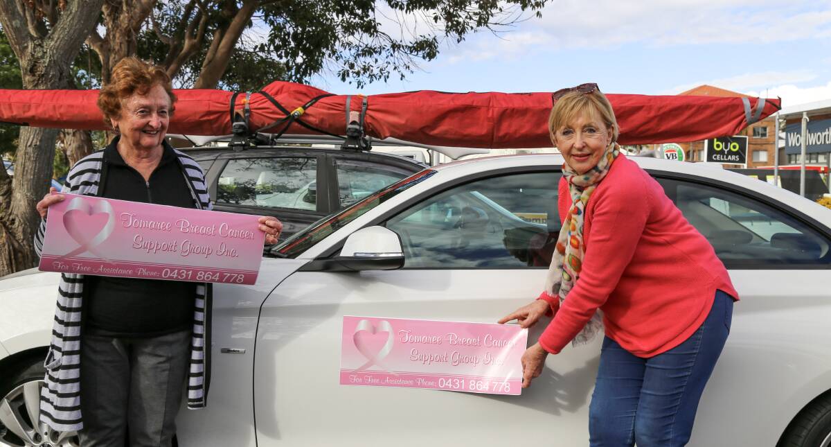CARING: Tomaree Breast Cancer Support Group president Judy Watton and vice president Jenny Marshall with the new car decals.