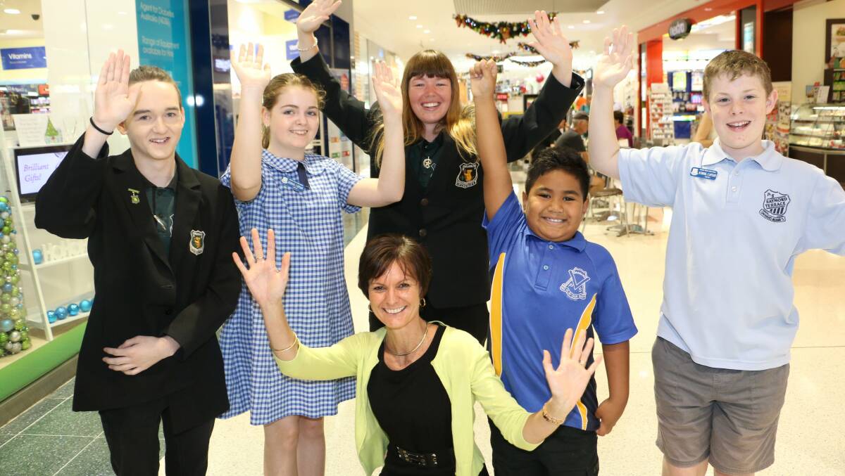 Colleen Mulholland-Ruiz (front, centre) with students from Raymond Terrace schools that take part in the PBL program in 2014. 