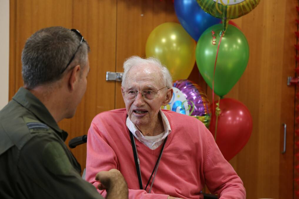 Squadron Commander Chris Rogers and Don Howard engrossed in conversation on May 15 - Mr Howard's 100th birthday. Picture: Ellie-Marie Watts