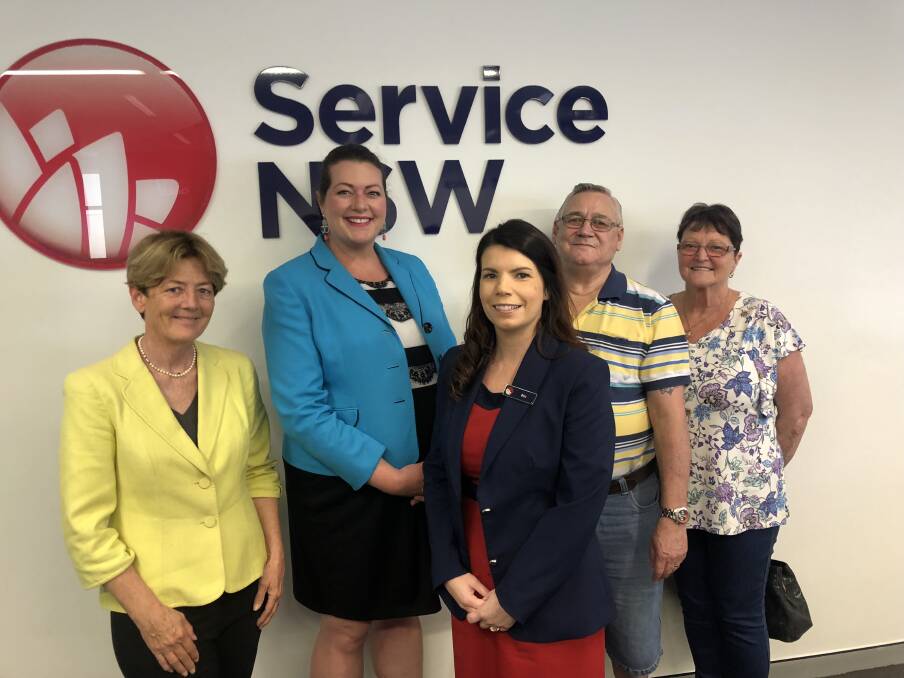 Port Stephens Duty MLC Catherine Cusack, Liberal Candidate Jaimie Abbott, Cost of Living specialist Bec Agland and Raymond Terrace residents Joan and Jeff Gibson at the Raymond Terrace Service NSW Centre on Monday.