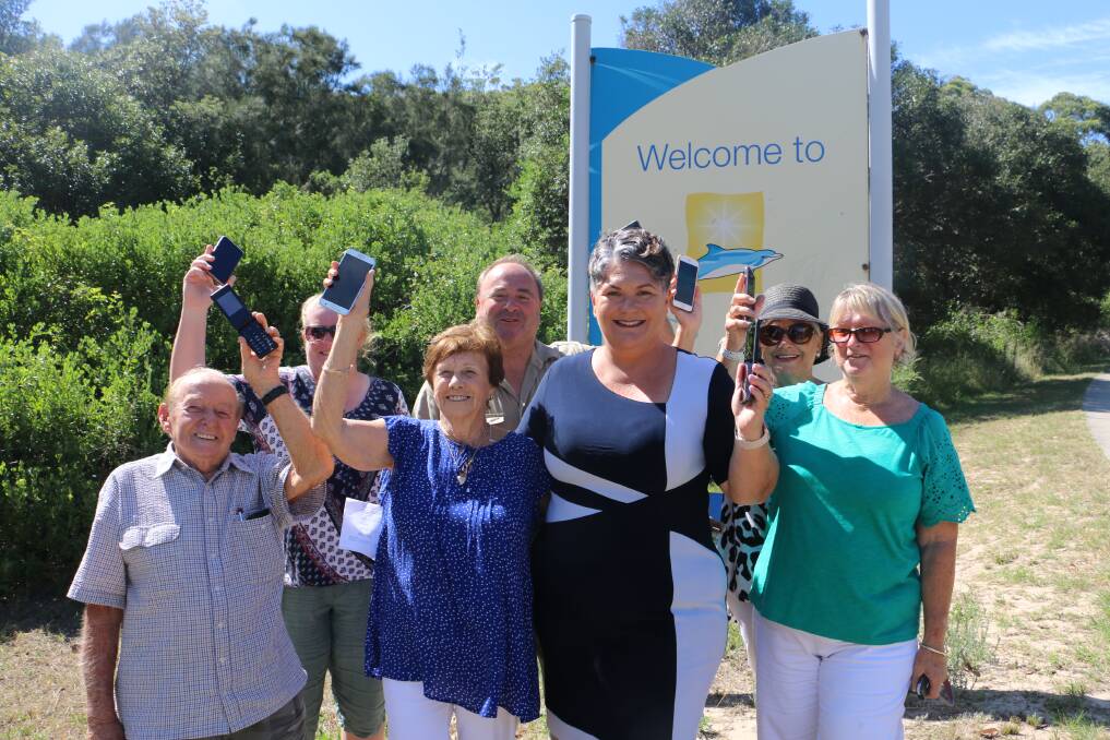 RING: Paterson MP Meryl Swanson with Boat Harbour residents happy to be getting a mobile phone tower.
