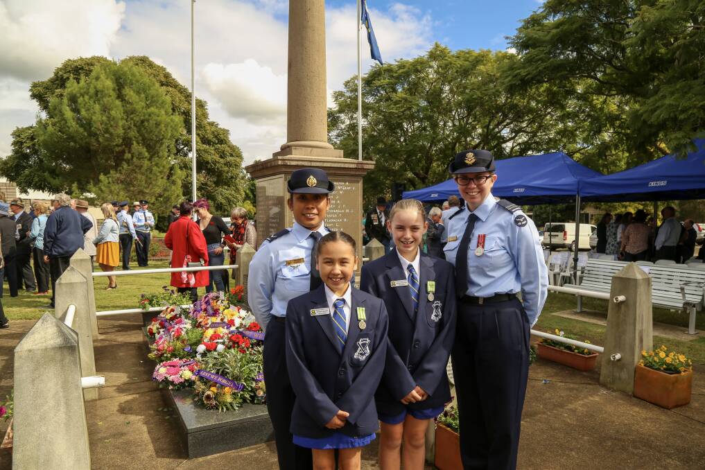 FAMILY CONNECTION: Williamtown RAAF Base Leading Aircraftwoman Jeanny O'Neill with daughter Ahrna O'Neill and Flight Lieutenant Sarah Galbraith with daughter Ella Mawby at the Raymond Terrace wear memorial. The two Irrawang Public School captains brought their mothers to the service to lay a wreath together.