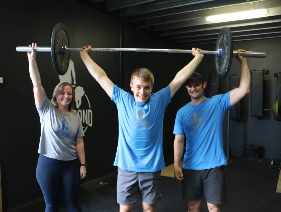 Rhys Stewart, 14, with trainers Alana and Adam Edwards.