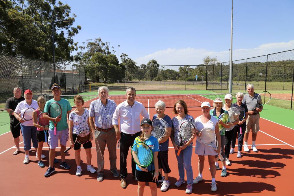 Tilligerry Tennis Club members, Foreshore Tennis coaches, community members and councillors Steve Tucker and Ryan Palmer on the new hardcourt at Mallabula tennis centre.