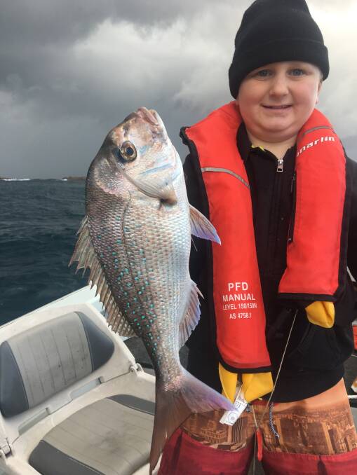 BIG CATCH: Guest columnist for this week Joey Pearce, 9, with his 50cm snapper caught off northern side of Fingal Island last weekend. 