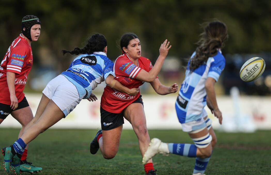 SELECTION: Nelson Bay's Bobbi Law, centre, playing in the rugby union grand-final. Bobbi has been picked for the Newcastle ladies tackle squad for the CRL Country Championships. Picture: Marina Neil