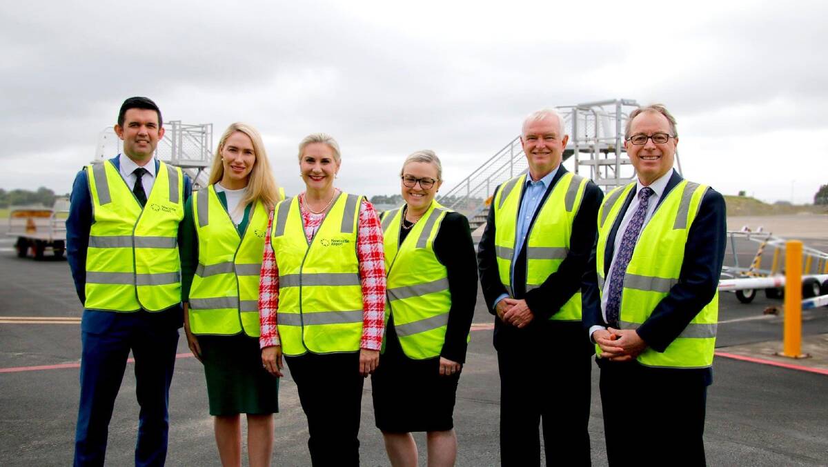 Liberal candidate Brook Vitnell, second from left, in Williamtown on Wednesday for the minister and senator's funding announcement. Picture: Supplied