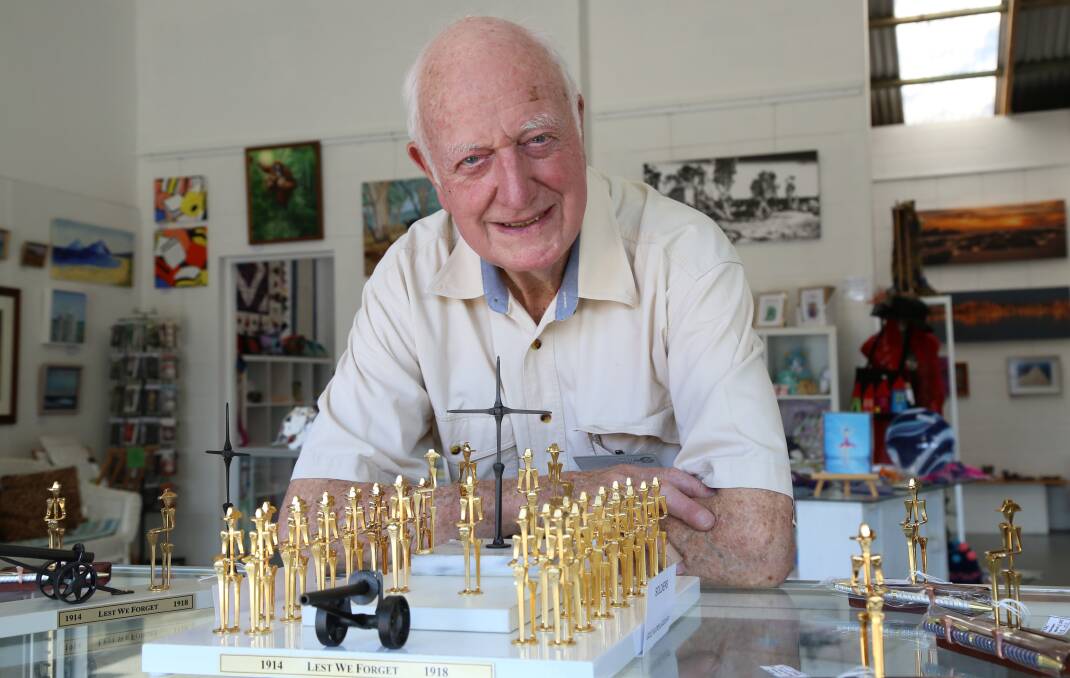 RESPECT: Tanilba Bay artist Vic Marden with his horseshoe nail sculpture at Tilligerry Art Gallery. Each of the 34 soldiers is made using seven horseshoe nails.