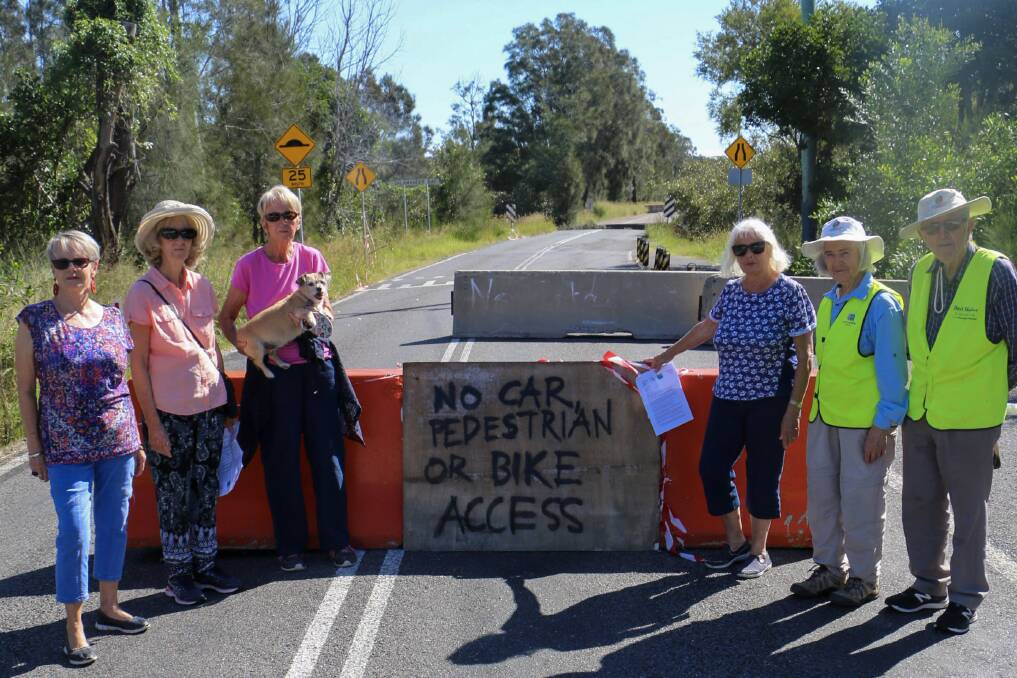 ROAD BLOCK: Members of the Members of the Mambo Wanda Wetlands, Reserves and Landcare Committee and Mambo Wanda Wetlands Conservation Group with presidents Roz Armstrong (left) and Irene Jones (third from right) at the Foreshore Drive road closure.