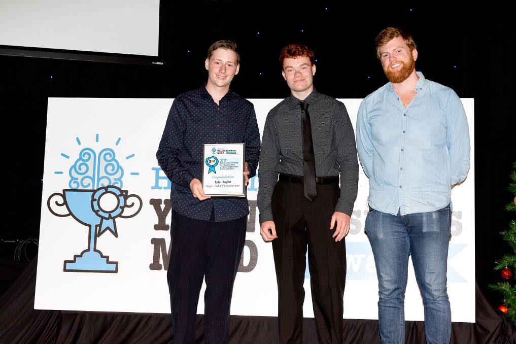 Tomaree High School students and Orchard School Systems creators Tyler Regan, 17, and Dakota Nicholson, 16, received a 2017 Hunter Young Business Mind Award from Harry Balding.
