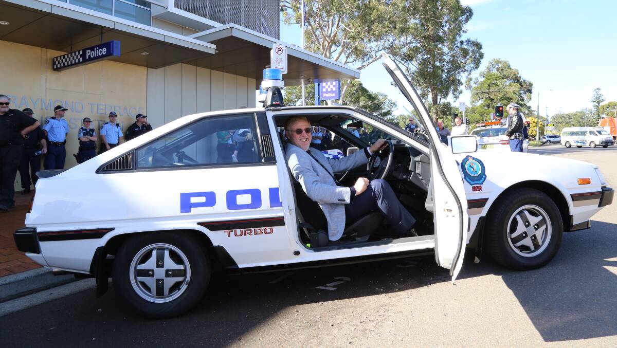 Retired senior constable John Simmons from Traffic and Highway Patrol relived his earlier days in the NSW Police Force by driving a Mitsubishi Cordia police vehicle home from his retirement party in Raymond Terrace on Thursday. Pictures: Ellie-Marie Watts