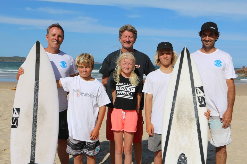 Jimmi Hill, 10, Jessica Stretton, 11, and Isaac Sullivan , 13, with (back, from left) John Sullivan, Dave Stretton and Rod Astley at One Mile Beach. Picture: Ellie-Marie Watts