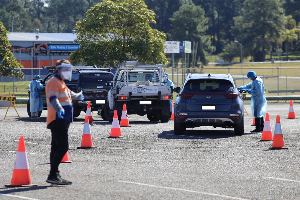 Cars lined up at the new Raymond Terrace drive-through COVID-19 testing clinic at Lakeside Sports Complex about noon on Tuesday, August 10. 