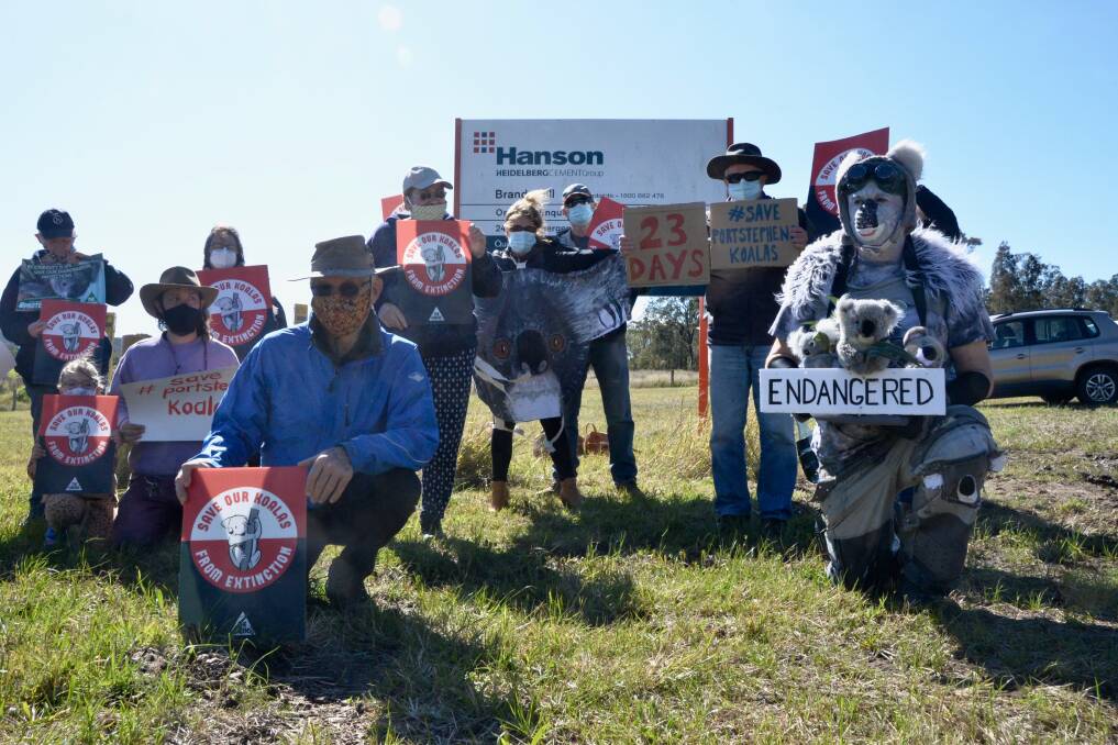 STILL FIGHTING: Save Port Stephens Koalas campaigners outside Hanson quarry in Brandy Hill. The federal environment minister has approved the quarry's expansion. 
