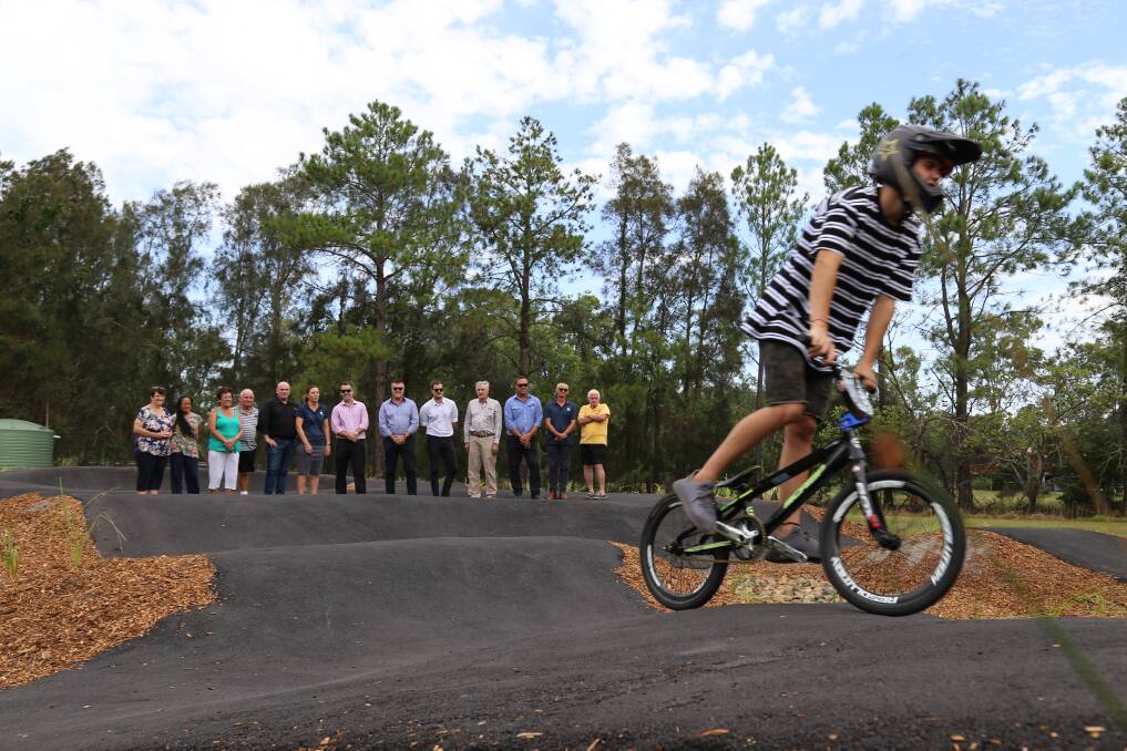 BMX champion Kale Warner whips around the Salt Ash track on Thursday as attendees to the official launch watch. Picture: Ellie-Marie Watts