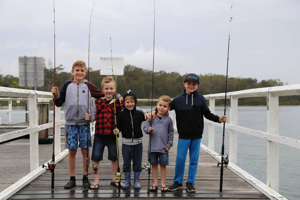 Cooper Watt, 11, Ben Johnson, 7, Xavier Styles, 6, Kai Johnson, 4, and Archer Watt, 7, on the Karuah jetty near Longworth Park where the town's oyster and timber festival will be held on October 20. Picture: Ellie-Marie Watts