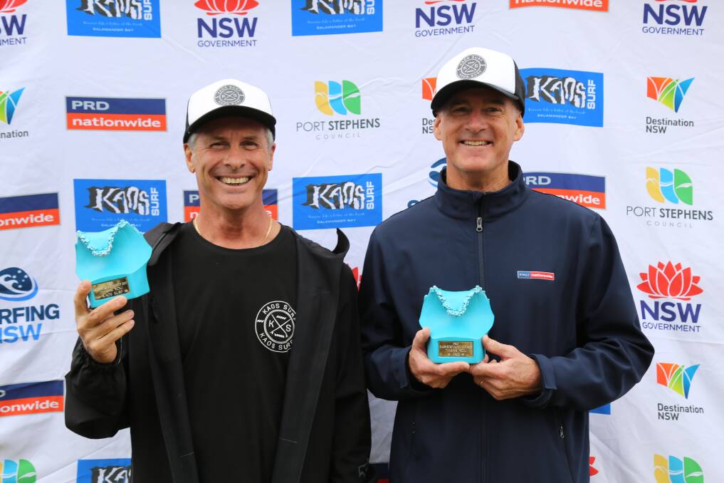 Kaos Surf owner Tony Bainbridge and PRD Port Stephens principal Bruce Gair were presented trophies after the 2017 Port Stephens Toyota NSW Pro in thanks for sponsoring the cadet cup. Picture: Ellie-Marie Watts