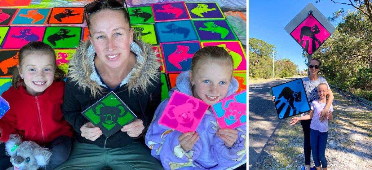 SIGN OF THE TIMES: Bay resident Casey Freeman and two of her three children - Isabella, aged 8, and Ruby, 6, with the homemade koala signs.